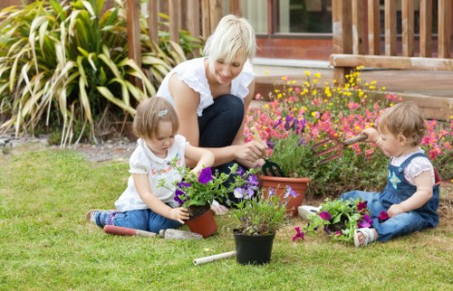 Seasonal garden maintenance in Redbridge with clean paths and healthy plants